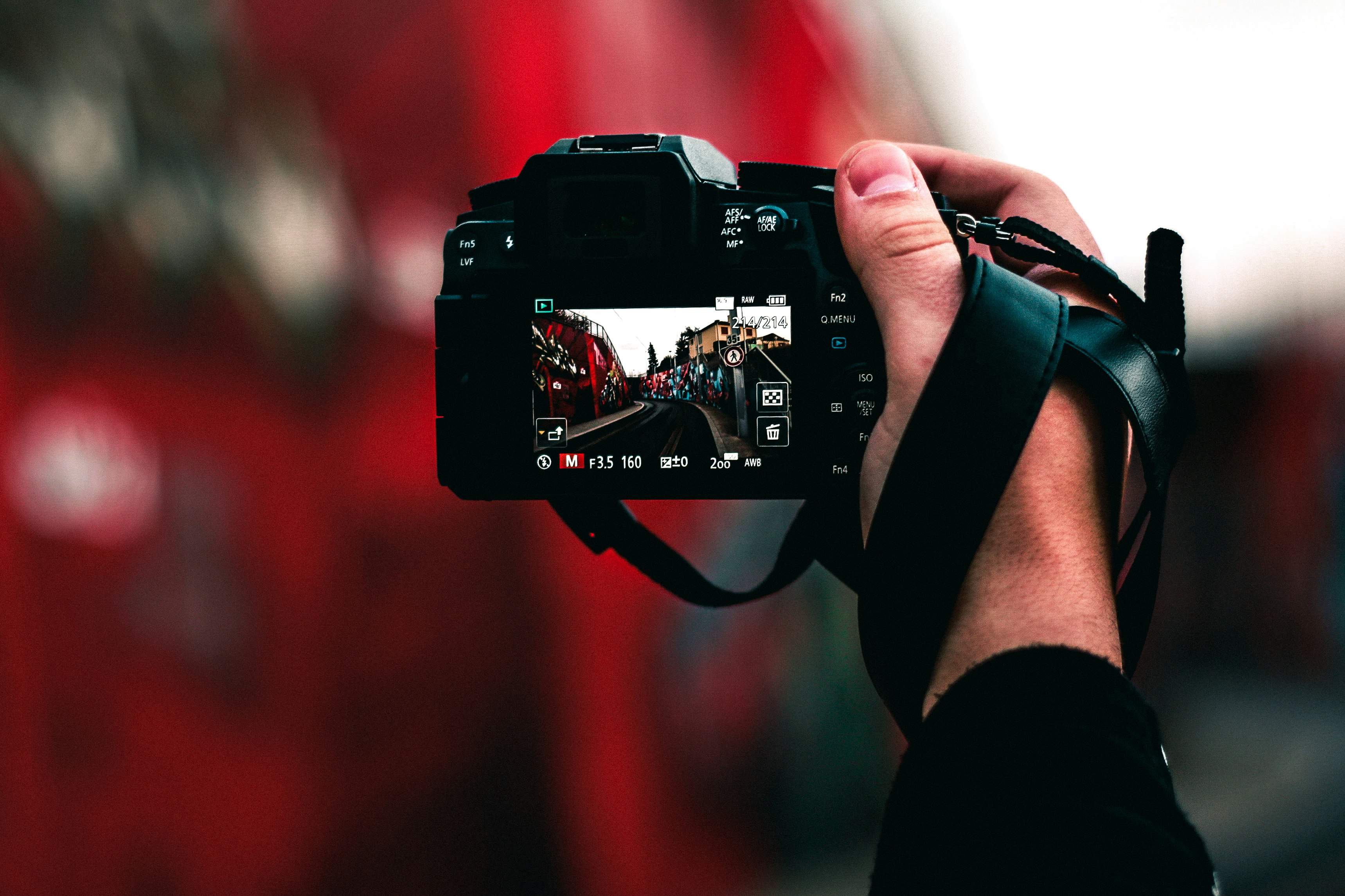 black DSLR camera capturing road